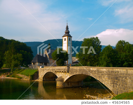 Church tower and stone bridge at Lake Bohinj Church tower and stone bridge at Lake Bohinj 45634565