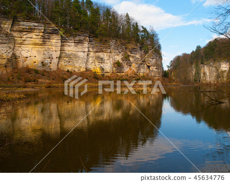 Sandstone rocks mirroring in the lake Sandstone rocks mirroring in the lake 45634776