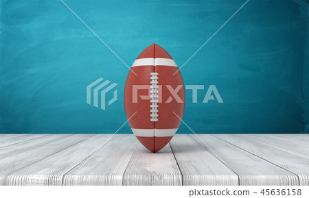 3d rendering of a ball for American football lying on a wooden desk on a blue background. 45636158