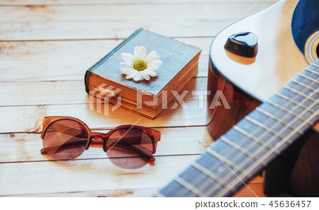 Close up classical guitar head with glasses and book Close up classical guitar head with glasses and book 45636457
