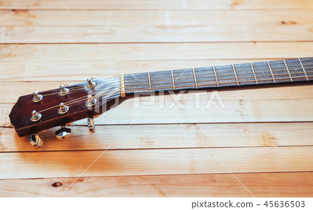 close up neck acoustic classical guitar on a light wooden background 45636503