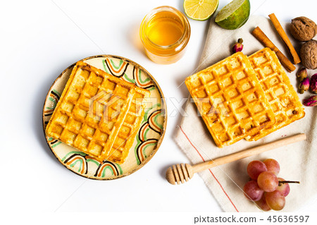 Homemade waffles served with fruits Homemade waffles served with fruits 45636597