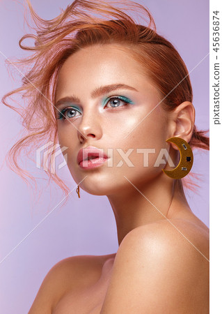 Beautiful girl with unusual accessories and make-up on a bright background. Beauty face. Beautiful girl with unusual accessories and make-up on a bright background. Beauty face. 45636874