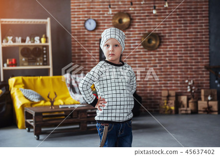 Child in soft warm pajama playing in bed 45637402