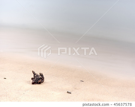 Sandy beach with stone on island, romantic colors 45637578