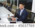 Young businessman sitting in meeting room 45637769