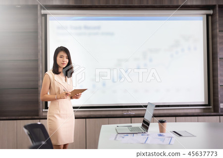 Young businesswoman presenting in the meeting room 45637773