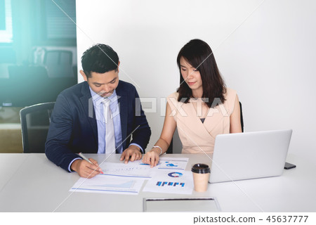 Business man and woman discussion in the office 45637777