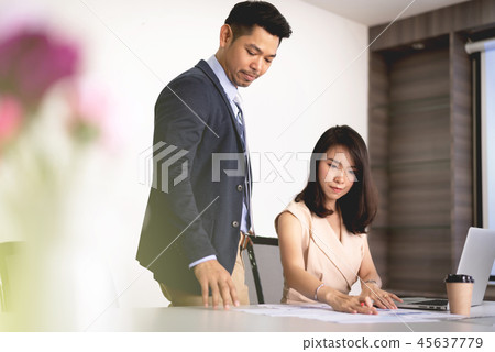Business man and woman discussion in the office 45637779
