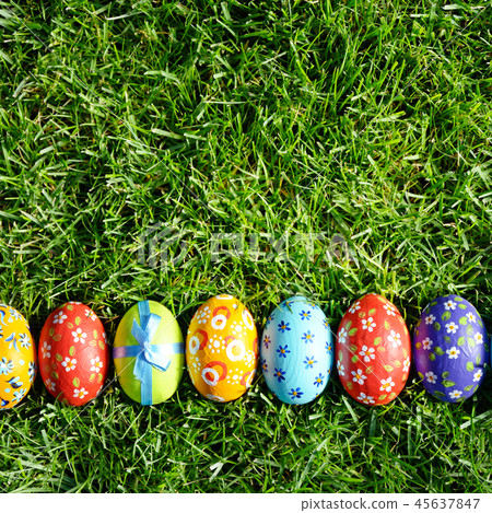 Easter eggs lying on green spring grass 45637847