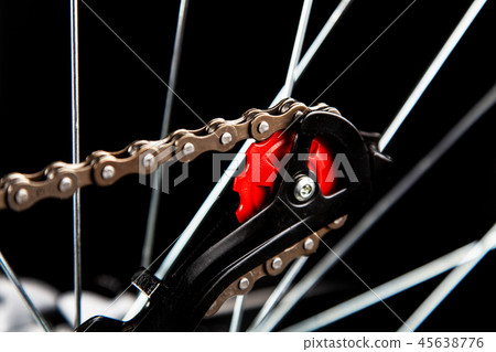 Bicycle parts isolated on black 45638776