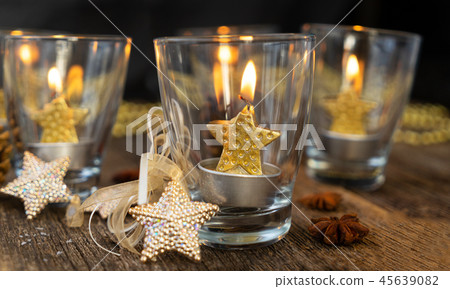 Glowing Christmas candles Glowing Christmas candles 45639082