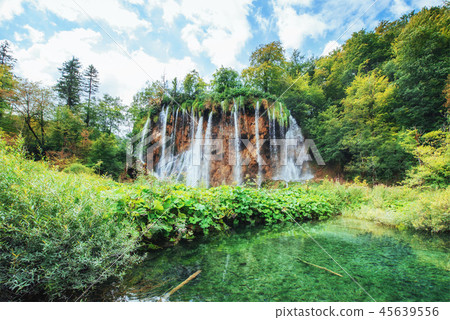 Waterfalls in national park falling into turquoise lake. Plitvice, Croatia 45639556