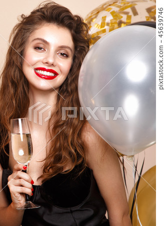 Beautiful young girl in elegant evening dress with festive balloons. Beauty face. 45639746