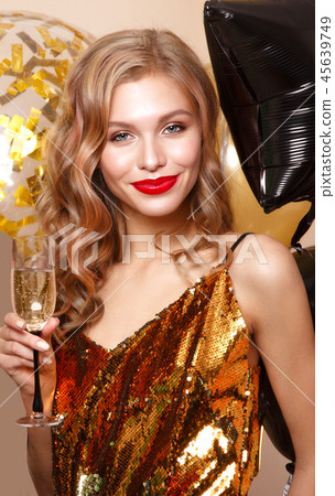 Beautiful young girl in elegant evening dress with festive balloons. Beauty face. 45639749
