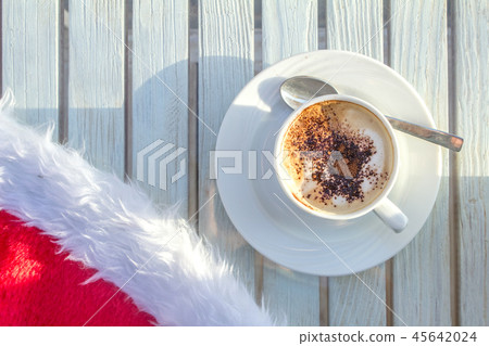 coffee cup and Santas hat, Christmas 45642024