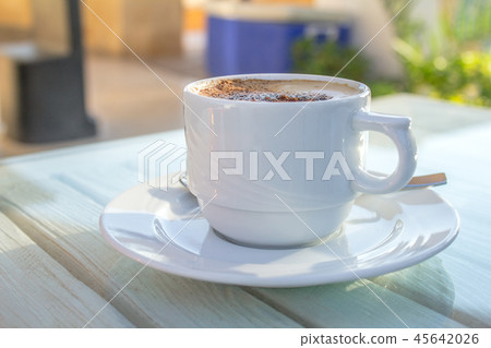 cup of cappuccino with latte white table 45642026