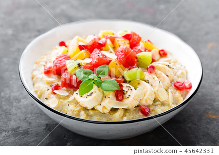 Oatmeal with fresh fruits and almond Oatmeal with fresh fruits and almond 45642331