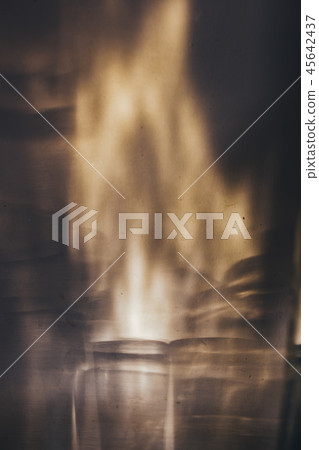 Glass goblets cast beautiful shadow and beautiful caustic effect as light passes through a glass in 45642437