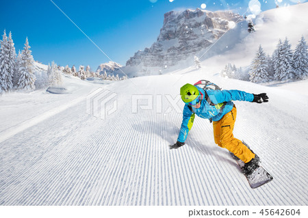 Man snowboarder riding on slope. 45642604