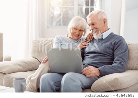 Beautiful elderly lady enjoying nice pictures with her husband Beautiful elderly lady enjoying nice pictures with her husband 45642692