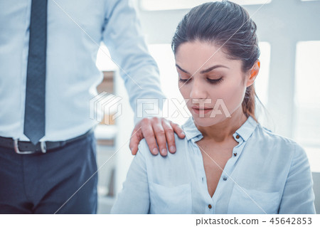 Obscene man in official clothes putting his hand on woman shoulder 45642853