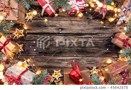 Christmas gifts on wooden background 45642878
