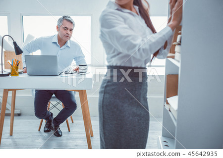 Grey-haired superior viewing from head to toe Grey-haired superior viewing from head to toe 45642935