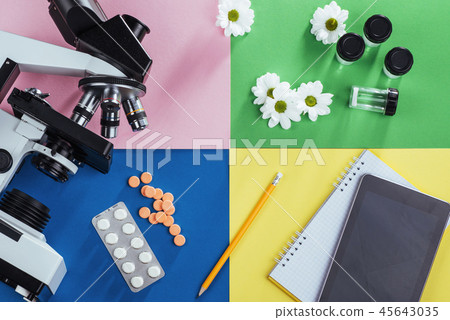 view from the mountain microscope with tablets and notebook on a colored background. 45643035