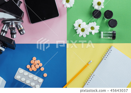 view from the mountain microscope with tablets and notebook on a colored background. 45643037