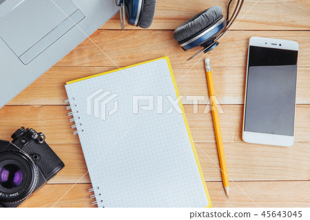 Top view of notebook, stationery, drawing tools and a few glasses. improvise. Top view of notebook, stationery, drawing tools and a few glasses. improvise. 45643045