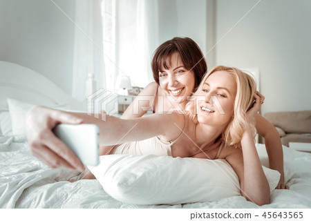 Beautiful blonde blue-eyed girl taking family photo 45643565