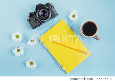 On the blue background notebook pencil, ruler and white flowers On the blue background notebook pencil, ruler and white flowers 45643620