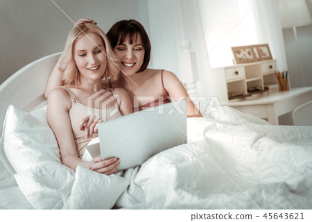 Joyful peaceful girls cuddling in their nest Joyful peaceful girls cuddling in their nest 45643621