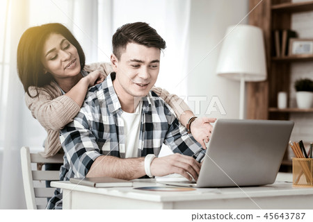 Attentive male person trying to complete task Attentive male person trying to complete task 45643787