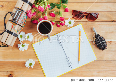 camera, glasses and notepad and pencil on a brown wooden background camera, glasses and notepad and pencil on a brown wooden background 45644472