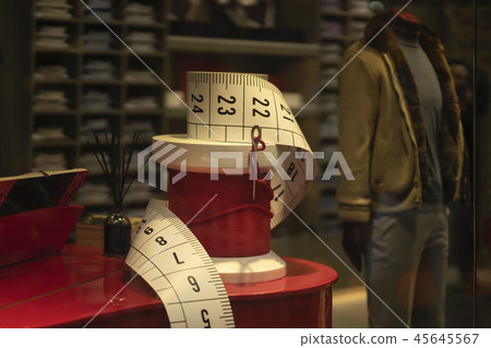 Shop window, men's clothing atelier, mannequin and shop equipment in the form of decorative sewing Shop window, men's clothing atelier, mannequin and shop equipment in the form of decorative sewing 45645567