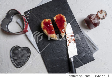 Strawberry sauce poured on a homemade cake.  45645591