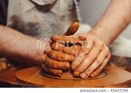 Potter makes a jug 45647299