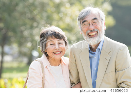Cuddling Japanese senior couple park outdoors Cuddling Japanese senior couple park outdoors 45656033