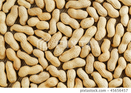 Peanuts in their shell textured food background. Peanuts in their shell textured food background. 45656457