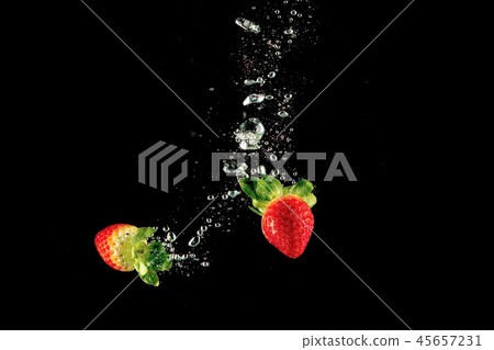 trawberry dropped into water with splash. 45657231