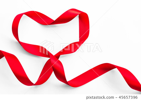 Red ribbon in heart shape isolated on white Red ribbon in heart shape isolated on white 45657396