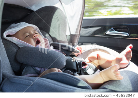 Close Up Asian cute newborn baby sitting in modern car seat. Close Up Asian cute newborn baby sitting in modern car seat. 45658047