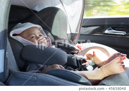 Close Up Asian cute newborn baby sitting in modern car seat. Close Up Asian cute newborn baby sitting in modern car seat. 45658048