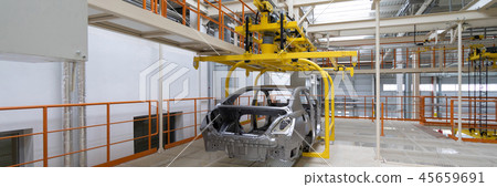 body of car on conveyor close-up. Automotive production line. long format. Wide frame body of car on conveyor close-up. Automotive production line. long format. Wide frame 45659691