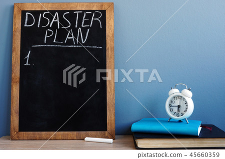 Disaster Plan written on a blackboard and notepads 45660359