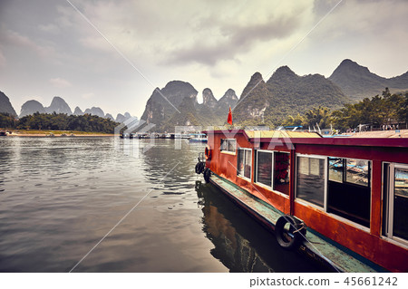 Boats moored at the Lijiang River bank in Xingping 45661242