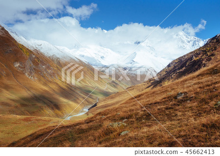 golden autumn landscape between the rocky mountains in Georgia. Malvnychi snow-capped peaks. Europe 45662413