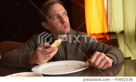 Young guy eating by Hands Khachapuri eastern cuisine Restaurant, Young guy eating by Hands Khachapuri eastern cuisine Restaurant, 45662536